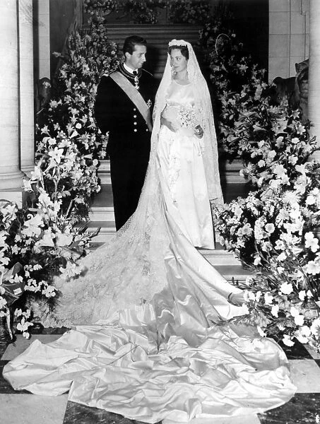 Prince Albert 25, and his bride Princess Paola Ruffo Di Calabria, 21, pose for