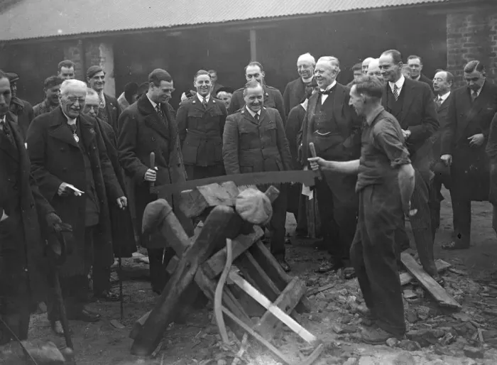 Framed Print : Prince George tries his hand at sawing wood Framed Print : Prince George tries his hand at sawing wood