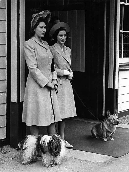 Princesses Elizabeth and Princess Margaret with their pet dogs at Ballater Station