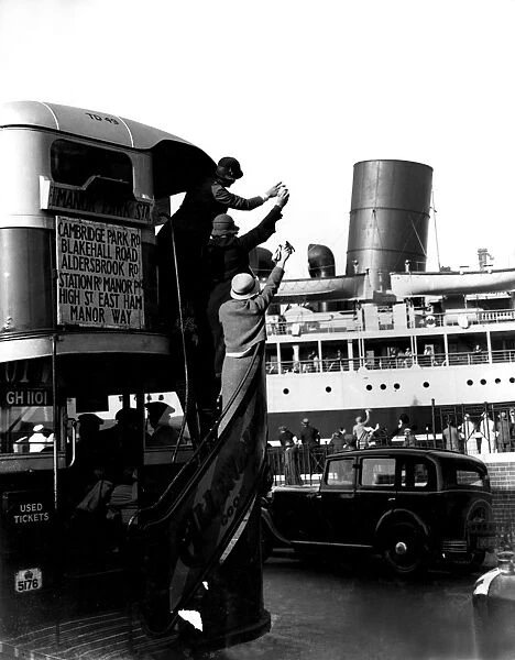 The public waving off a ship from a passing bus