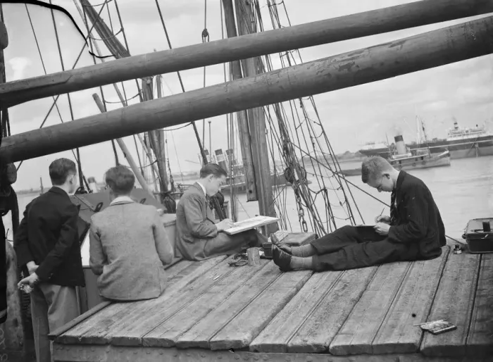 Framed Print : Pupils from the art school sit on the deck of a Thames Barge drawing pictures in Framed Print : Pupils from the art school sit on the deck of a Thames Barge drawing pictures in