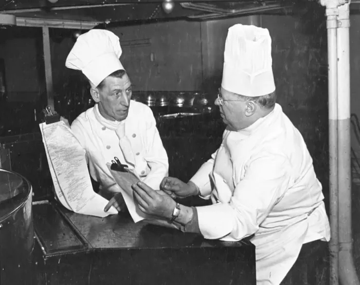 Framed Print : Queen Mary Chef Mr J. Pearce, assisted by second chef, Mr George Thomas (left) goes Framed Print : Queen Mary Chef Mr J. Pearce, assisted by second chef, Mr George Thomas (left) goes
