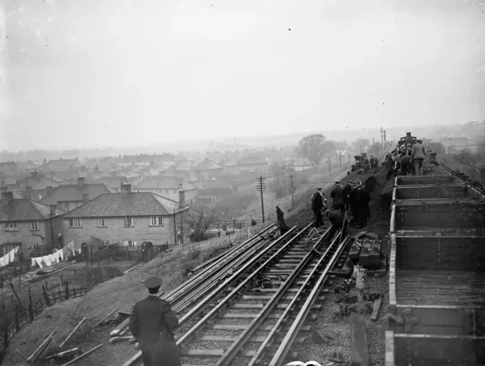 Framed Print : Rail workers work to clear the land slide and re lay track on the Wellhall line Framed Print : Rail workers work to clear the land slide and re lay track on the Wellhall line
