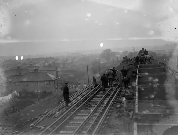 Framed Print : Rail workers work to clear the land slide and re lay track on the Wellhall railway line Framed Print : Rail workers work to clear the land slide and re lay track on the Wellhall railway line