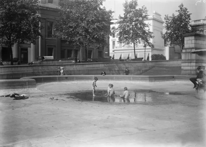 Framed Print : Rain Gods gift to little Londoners. Children bathing in a pool in the empty basins Framed Print : Rain Gods gift to little Londoners. Children bathing in a pool in the empty basins
