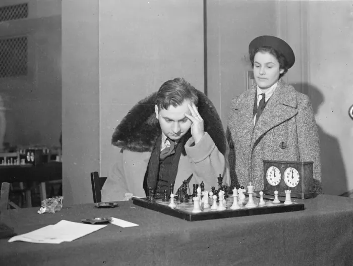 Framed Print : Reuben fine and his wife, at Hastings International chess Congress. Masters in a fur collar Framed Print : Reuben fine and his wife, at Hastings International chess Congress. Masters in a fur collar