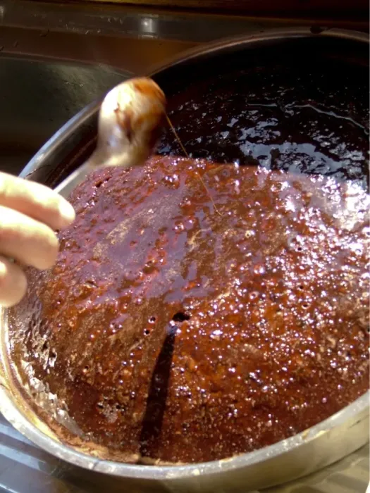 Framed Print : Rich sticky chocolate cake baked aboard Turkish gulet being dosed with chocolate
