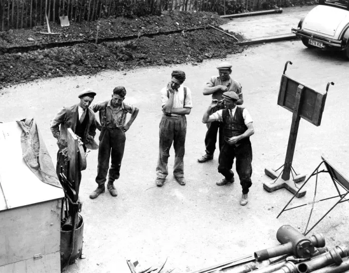 Framed Print : The road workers take a break from their manual labour for a cigarette and a game Framed Print : The road workers take a break from their manual labour for a cigarette and a game