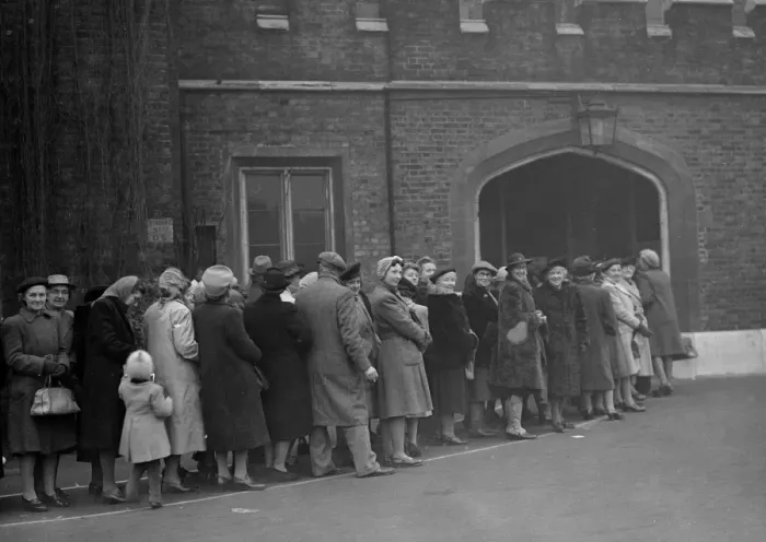 Framed Print : Royal wedding. Composed mainly of women, the eager queue waits patiently outside Framed Print : Royal wedding. Composed mainly of women, the eager queue waits patiently outside