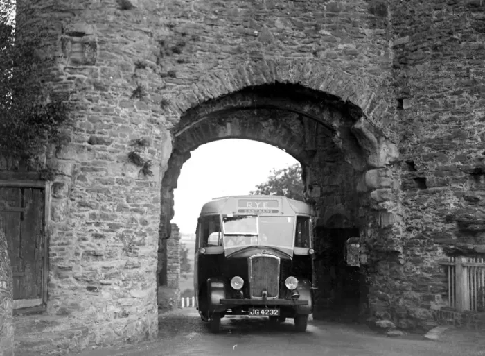 Framed Print : Rye bus passing through arch at Rye Tower in Sussex. 1934