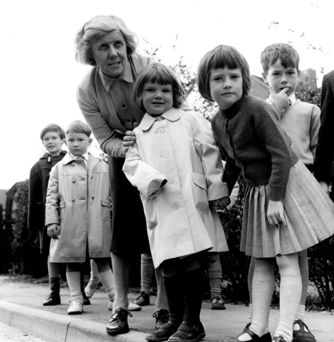 Framed Print : In Safe Hands - Miss Irene Fowler who runs a kindergarten school in Knockholt, Kent