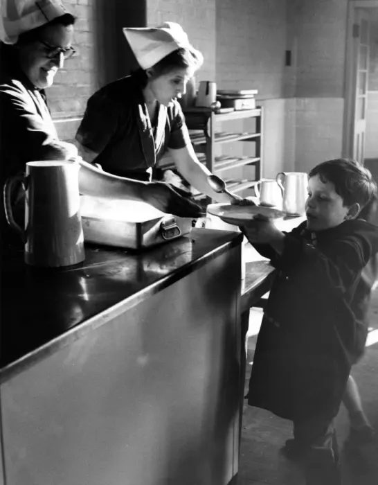 Framed Print : School dinners being served at a holiday play centre, set up at Creek Manor Secondary School Framed Print : School dinners being served at a holiday play centre, set up at Creek Manor Secondary School