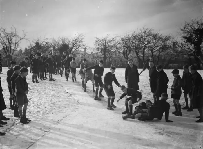 Framed Print : Schoolboys sliding on the snow on a path in Orpington, Kent. 1937 Framed Print : Schoolboys sliding on the snow on a path in Orpington, Kent. 1937