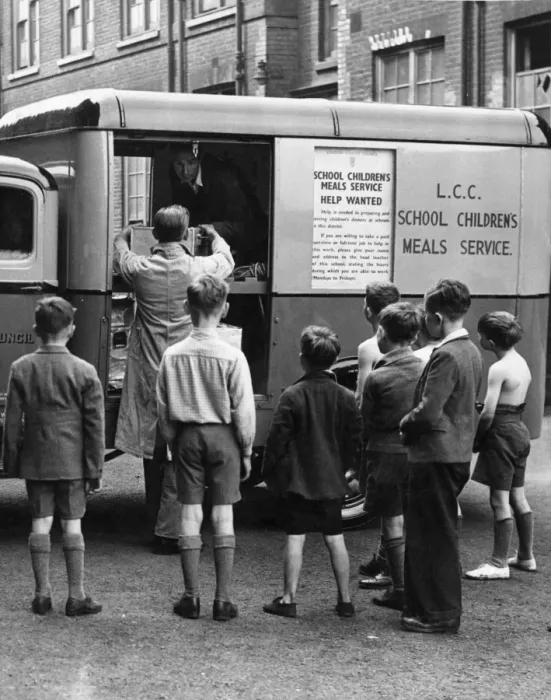 Framed Print : Schoolboys watch one of their meals-on-wheels arriving. Every day in various cooking centres Framed Print : Schoolboys watch one of their meals-on-wheels arriving. Every day in various cooking centres