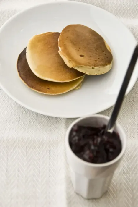 Framed Print : Three Scotch pancakes on a white plate with small pot of raspberry jam credit Framed Print : Three Scotch pancakes on a white plate with small pot of raspberry jam credit