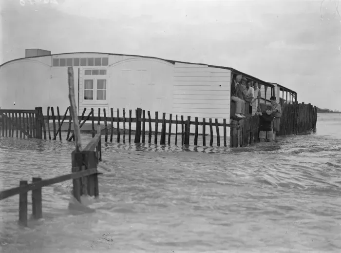 Framed Print : Sea defences broken by flood tide at Winchelsea, bungalows flooded and holidaymakers Framed Print : Sea defences broken by flood tide at Winchelsea, bungalows flooded and holidaymakers