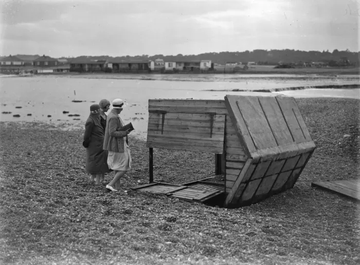 Framed Print : Sea defences broken by flood tide at Winchelsea, bungalows flooded and holidaymakers