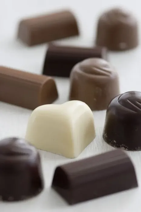 Framed Print : A selection of white, dark, and milk chocolates on white surface. credit: Marie-Louise Framed Print : A selection of white, dark, and milk chocolates on white surface. credit: Marie-Louise