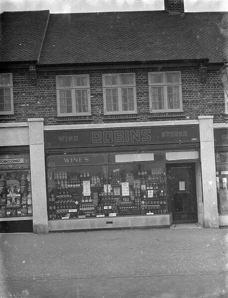 The shop front of Robins Off licence in Beckenham, Kent. 1 March 1936