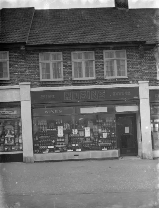 Framed Print : The shop front of Robins Off licence in Beckenham, Kent. 1 March 1936 Framed Print : The shop front of Robins Off licence in Beckenham, Kent. 1 March 1936