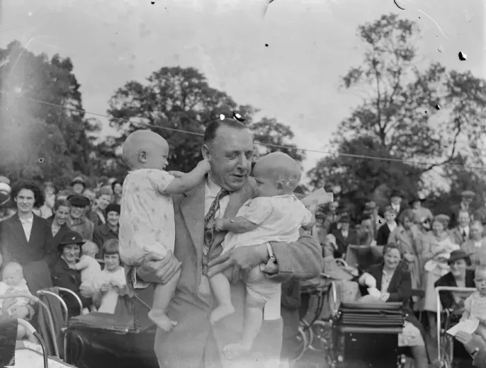 Framed Print : Sidcup Jubilee fete. Mr W Brown holds up twins at the baby show. 1939 Framed Print : Sidcup Jubilee fete. Mr W Brown holds up twins at the baby show. 1939