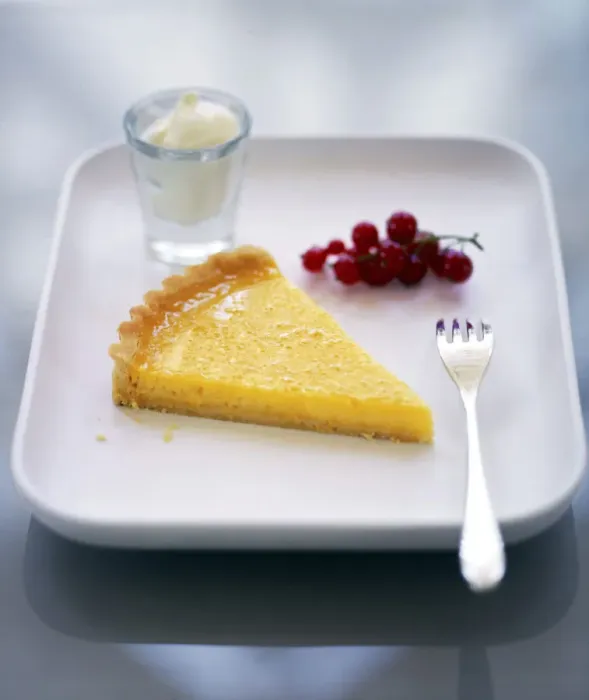 Framed Print : Slice of classic lemon tart served with fresh redcurrants, lemon zest and creme fraiche credit Framed Print : Slice of classic lemon tart served with fresh redcurrants, lemon zest and creme fraiche credit