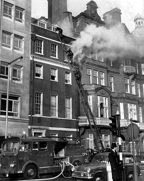 Smoke and flames pouring from a building in London Berkeley Square 1968