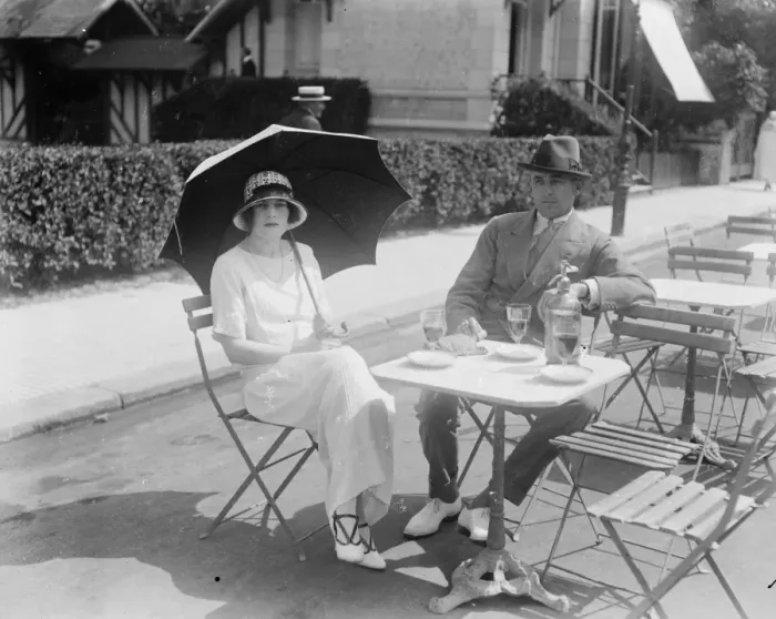 Framed Print : Society at Deauville. Captain and Mrs Maurice Kingscote outside the Potiniere Framed Print : Society at Deauville. Captain and Mrs Maurice Kingscote outside the Potiniere