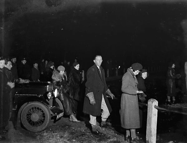 Spectators watching ice skating at the night by car light at Keston. 1933
