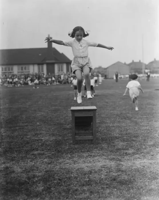 Framed Print : Sports day at the Days Lane Infant School in Sidcup, Kent. A little girl jumps
