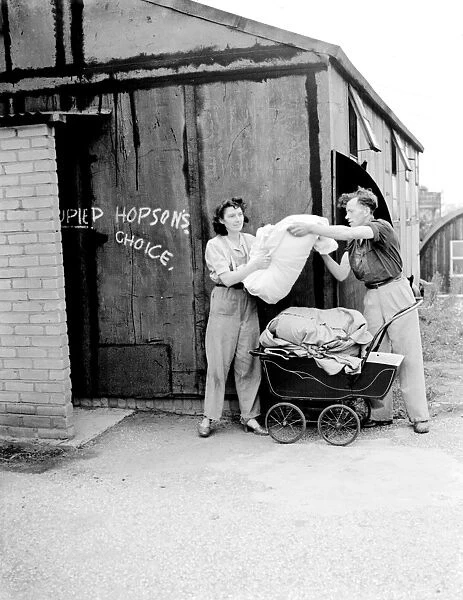 Squatters Mr and Mrs Hopson at the site huts, Crayford, Kent The empty military camps
