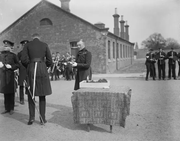 Framed Print : St Patricks Day with the Irish Guards. Col McCalmont decorating his hat after