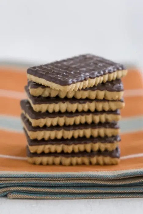 Framed Print : Stack of chocolate ginger biscuits on orange napkin credit: Marie-Louise Avery Framed Print : Stack of chocolate ginger biscuits on orange napkin credit: Marie-Louise Avery