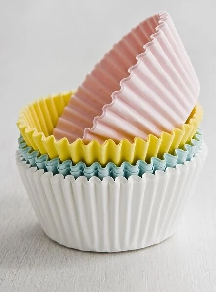 Stack of coloured paper cake and muffin cases credit: Marie-Louise Avery  /  thePictureKitchen
