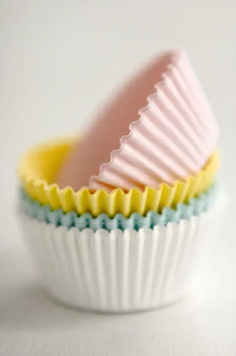 Framed Print : Stack of pastel coloured muffins cases credit: Marie-Louise Avery / thePictureKitchen Framed Print : Stack of pastel coloured muffins cases credit: Marie-Louise Avery / thePictureKitchen