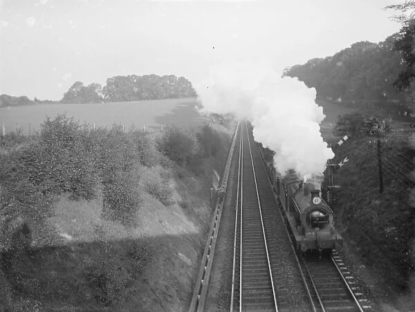 Steam train passes a signal
