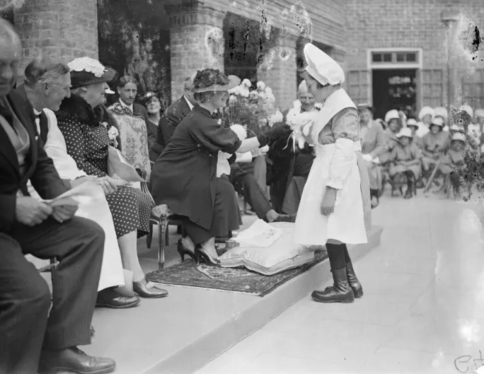 Framed Print : The Suchess pets a rabbit. She visitied Schools in Chailey. The Duchess of York