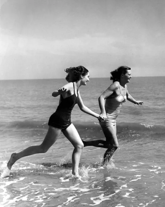 Framed Print : The sun comes to greet these two fair holiday makers, and they run to meet it half way