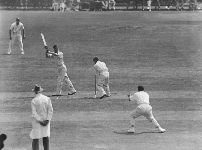 Framed Print : Surrey versus Sussex at Brighton. Ducat hits a boundary. 22 July 1925