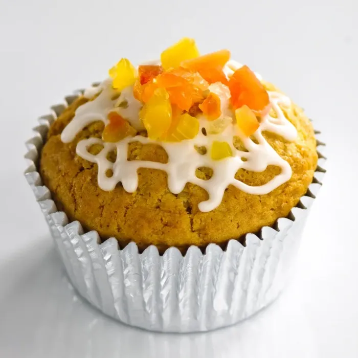 Framed Print : Sweet muffin in foilcase topped with candied fruit and icing trails credit: Marie-Louise Framed Print : Sweet muffin in foilcase topped with candied fruit and icing trails credit: Marie-Louise