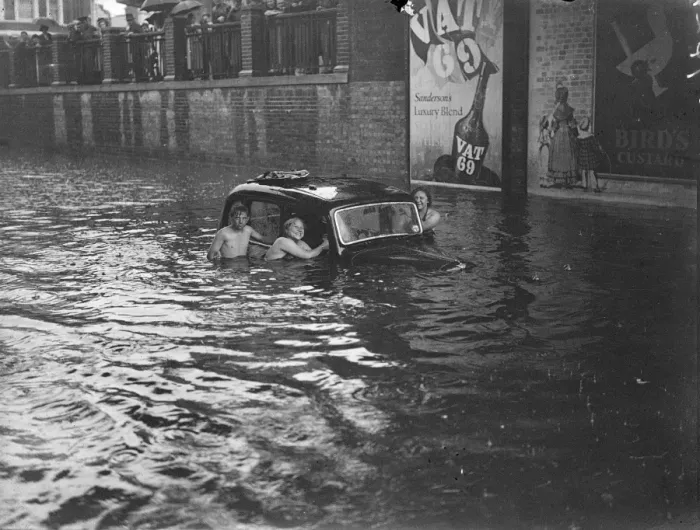 Framed Print : Swimmers around submerged vehicles in the greatest recorded floods in Kingston Framed Print : Swimmers around submerged vehicles in the greatest recorded floods in Kingston
