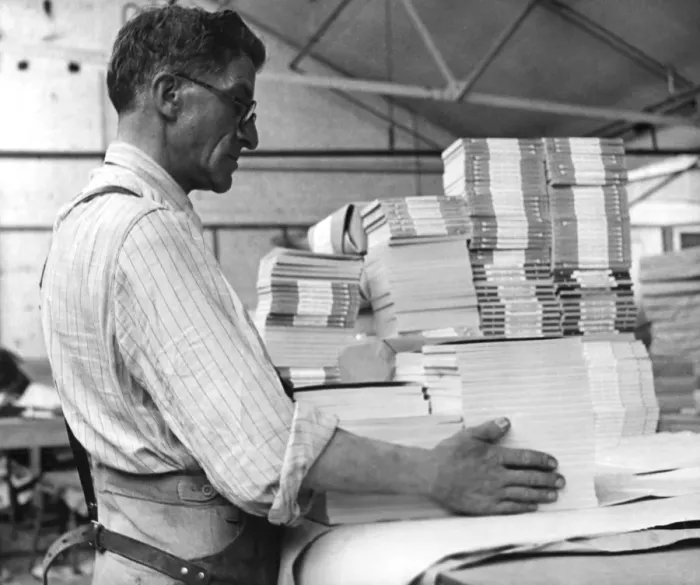 Framed Print : Sydney Payne packing for export. Like many of the Penguin Books staff, he has been Framed Print : Sydney Payne packing for export. Like many of the Penguin Books staff, he has been
