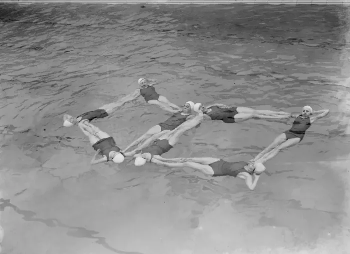 Framed Print : A synchronized swimming group perform a floating display at the opening for the new Framed Print : A synchronized swimming group perform a floating display at the opening for the new