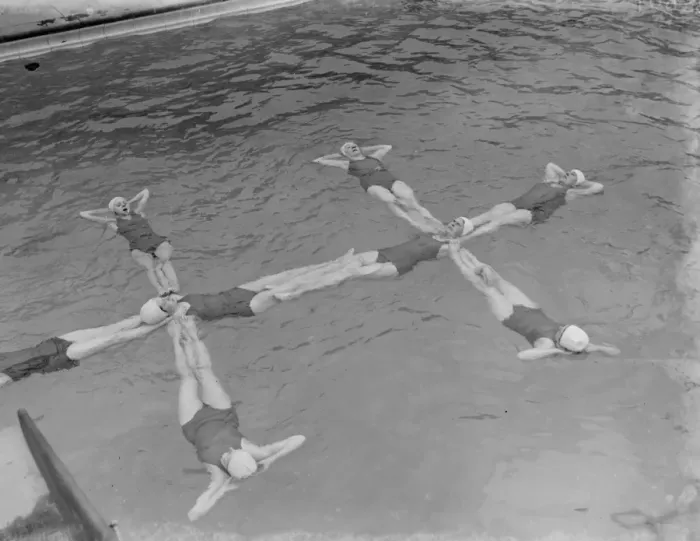 Framed Print : A synchronized swimming group perform a floating display at the opening for the new Framed Print : A synchronized swimming group perform a floating display at the opening for the new