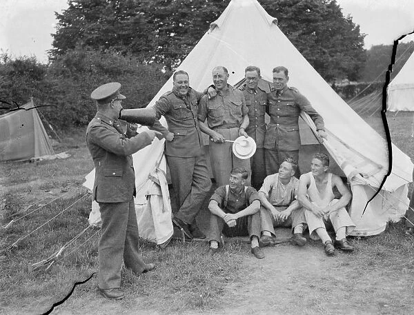 Territorial Army recruits at camp in Chichester, Sussex. Giving instructions through a horn