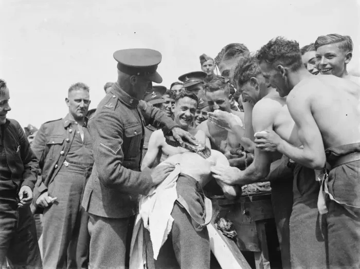 Framed Print : Territorial Army recruits at camp in Lympne, Kent. A Territorial is having his Framed Print : Territorial Army recruits at camp in Lympne, Kent. A Territorial is having his