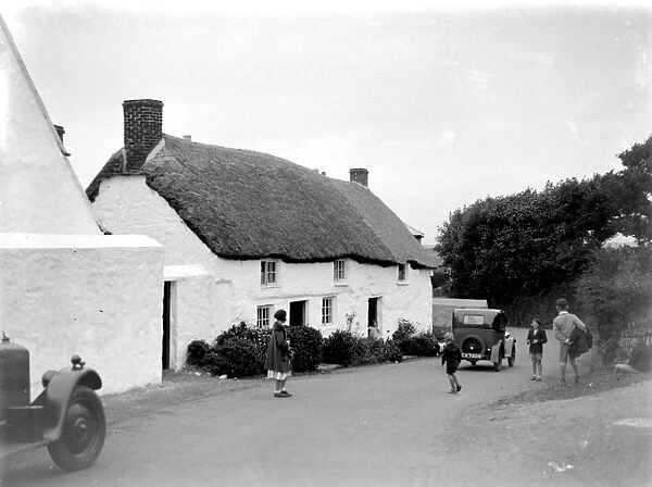 Thatched cottage in a country village. 1933