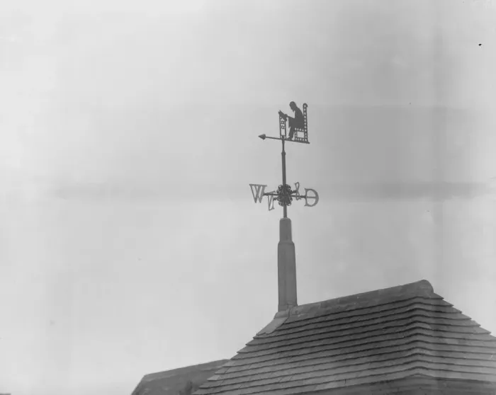 Framed Print : Thomas Carlyle as library weathervane. A silhouette figure of Thomas Carlyle reading Framed Print : Thomas Carlyle as library weathervane. A silhouette figure of Thomas Carlyle reading