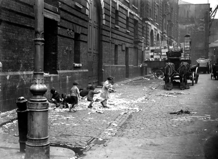 Framed Print : Toddlers & small chidren playing in the street by the docks in London. 1933 Framed Print : Toddlers & small chidren playing in the street by the docks in London. 1933