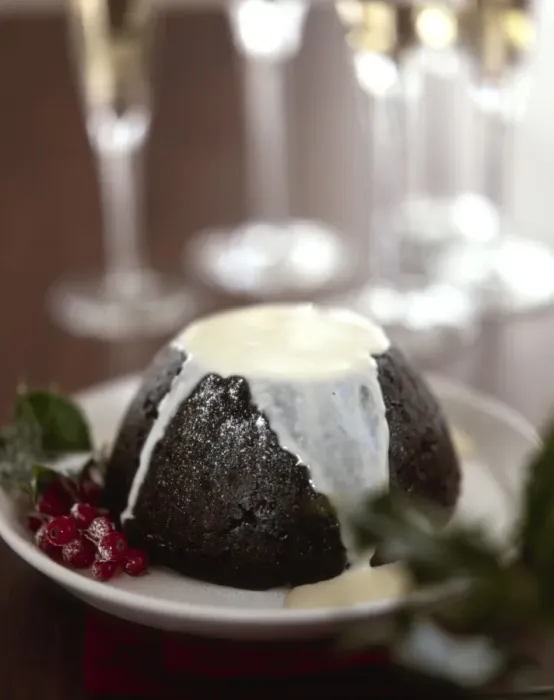 Framed Print : Traditional British Christmas pudding with thin cream or custard poured over Framed Print : Traditional British Christmas pudding with thin cream or custard poured over